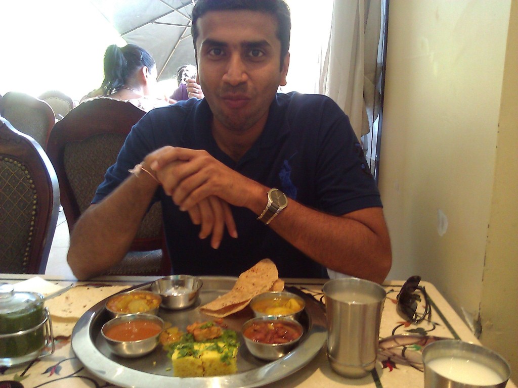 The hubby enjoying the Thali to his heart's content!!