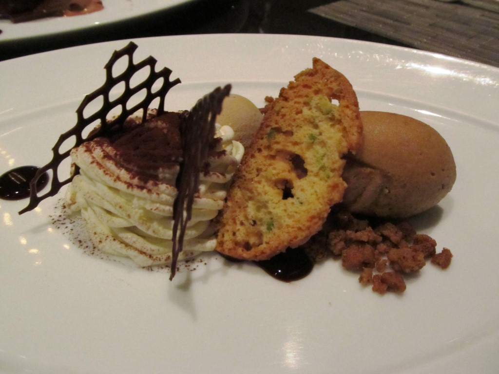 Dessert chocolate gelato with biscotti and whipped cream..