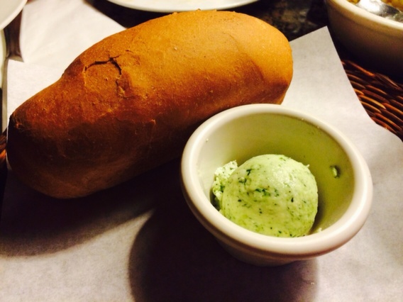 Fresh and warm bread with dill flavored butter